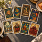 Eight tarot-style cards arranged in two rows on a black background. The cards feature richly detailed fantasy illustrations with gold borders and labels reading The Sun, The Chaos, Strength, The Wheel of Fortune, The Moon, The Emperor, The Magician, and The Empress.