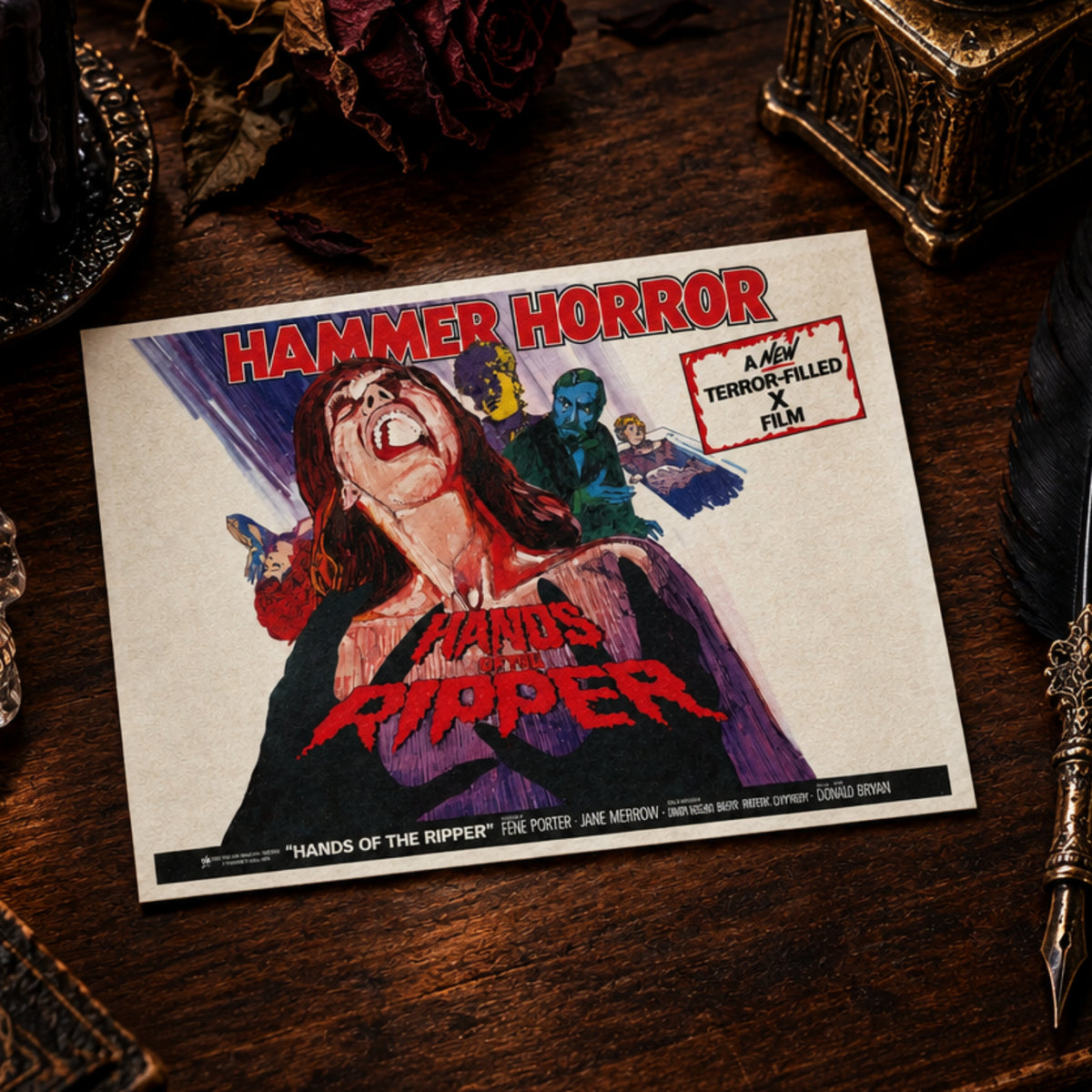 A rectangular Hammer Horror movie poster for 'Hands of the Ripper' featuring a screaming woman in a black dress with red blood, blue figures in the background, and bold red title text on a white field.