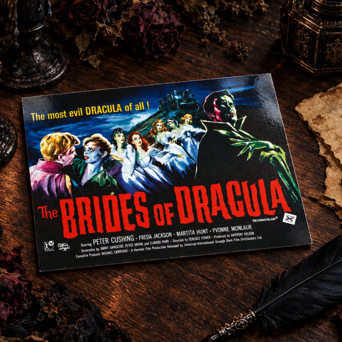 A vintage movie poster for 'The Brides of Dracula' resting on a wooden tabletop. The poster features classic horror artwork with Dracula in the foreground and the cast listed at the bottom, including Peter Cushing, Freda Jackson, and others.
