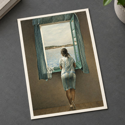 A painting of a woman seen from behind, wearing a light blue dress and standing by an open window that looks out onto a body of water and distant land. The room interior is dark brown, with blue curtains framing the window.