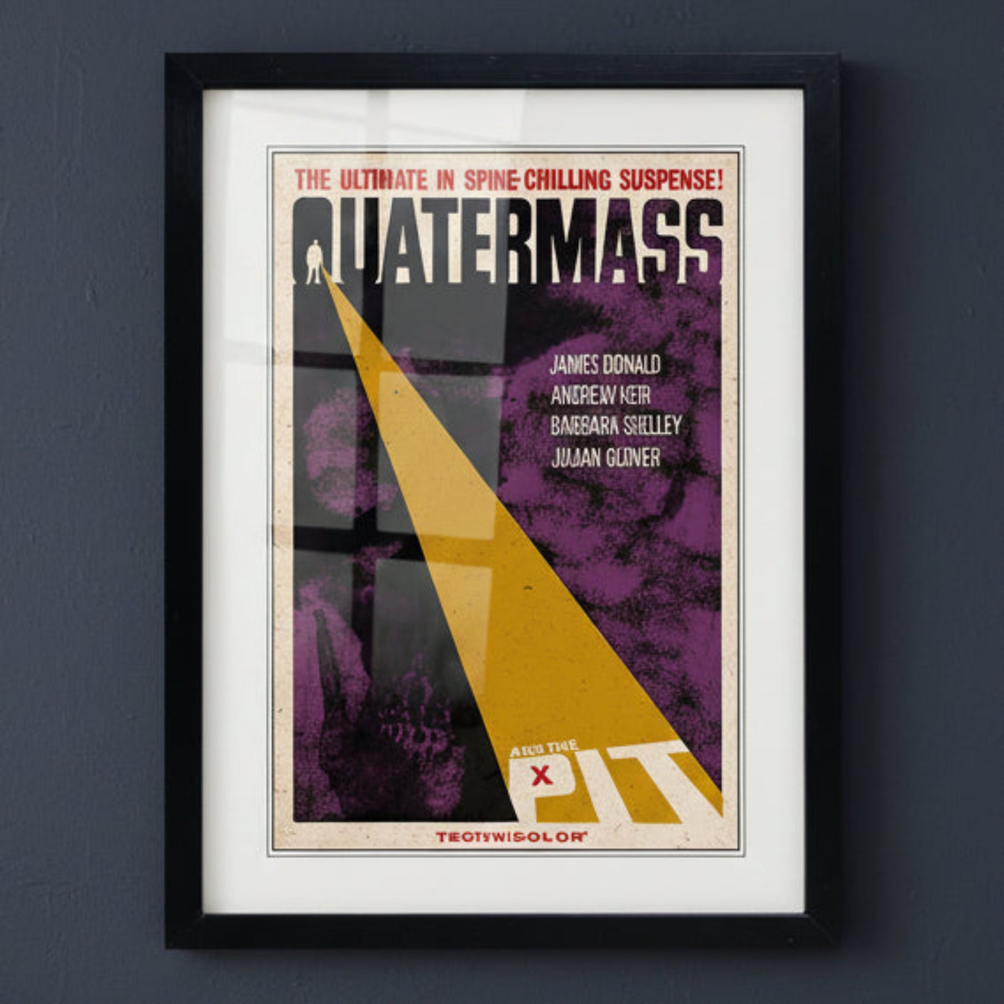 A framed vintage movie poster for the film 'Quatermass' with a black frame, white mat, and a poster design featuring purple, yellow, black, and red elements.