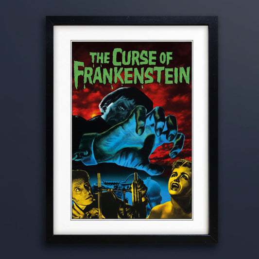 Framed vintage-style poster for 'The Curse of Frankenstein' with a black frame, white mat, and a dramatic illustration featuring a giant blue hand, red sky, and green title text.