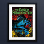 Framed vintage-style poster for 'The Curse of Frankenstein' with a black frame, white mat, and a dramatic illustration featuring a giant blue hand, red sky, and green title text.