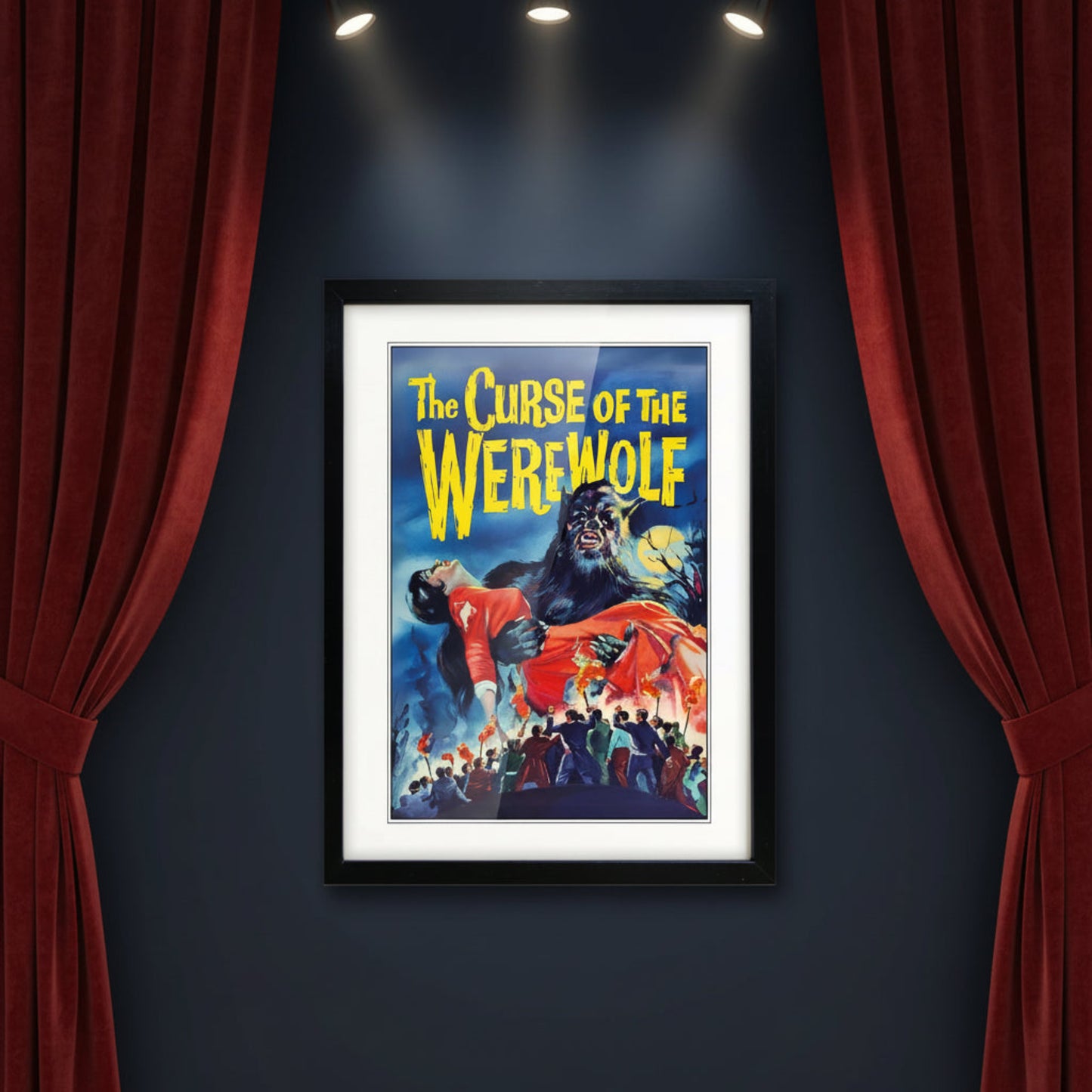 Framed vintage-style poster art for 'The Curse of the Werewolf' with a black frame, white mat, and a dramatic illustration showing a werewolf holding a woman in a red dress against a blue night sky.