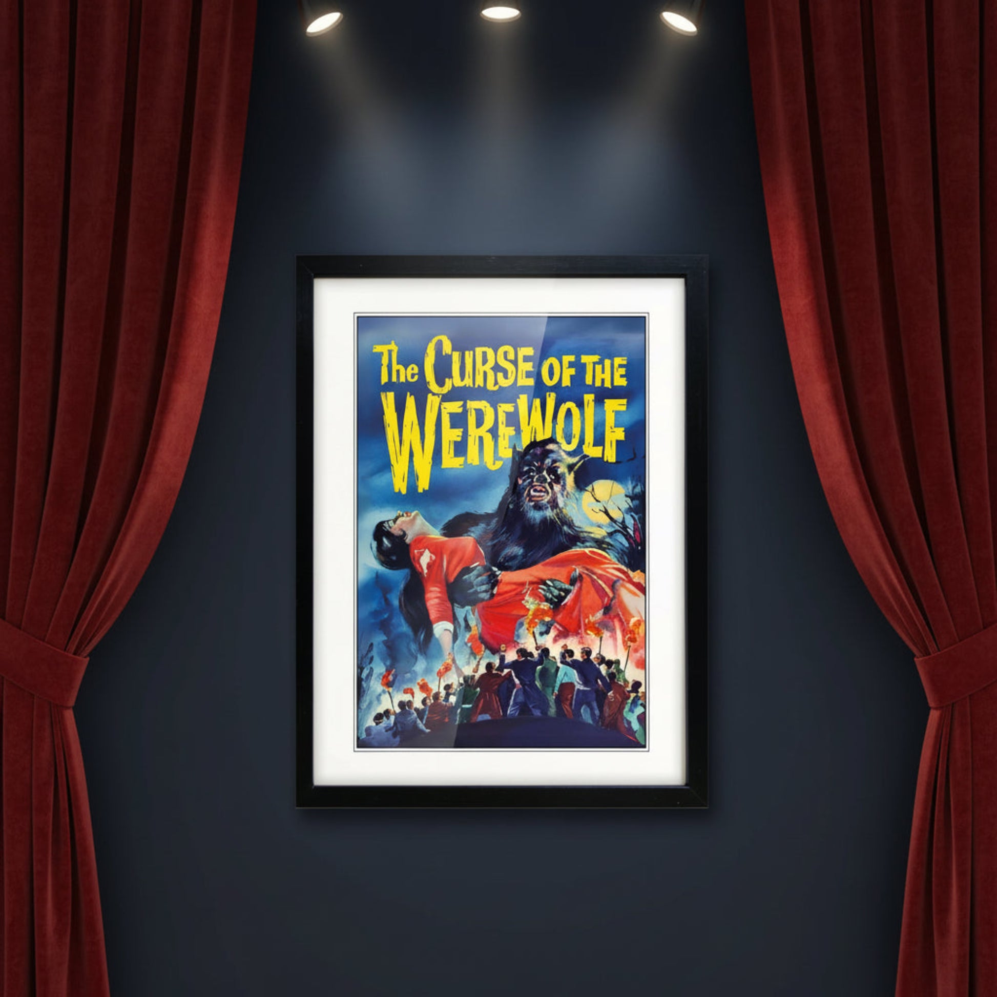 Framed vintage-style poster art for 'The Curse of the Werewolf' with a black frame, white mat, and a dramatic illustration showing a werewolf holding a woman in a red dress against a blue night sky.