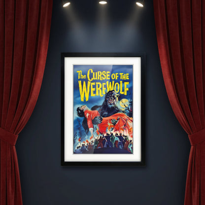 Framed vintage-style poster art for 'The Curse of the Werewolf' with a black frame, white mat, and a dramatic illustration showing a werewolf holding a woman in a red dress against a blue night sky.