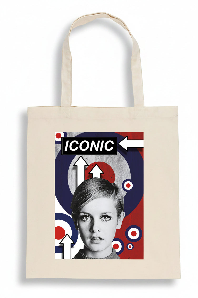 A beige canvas tote bag featuring a graphic print of a black-and-white portrait of Twiggy with the word 'ICONIC' and red, white, and blue target motifs.
