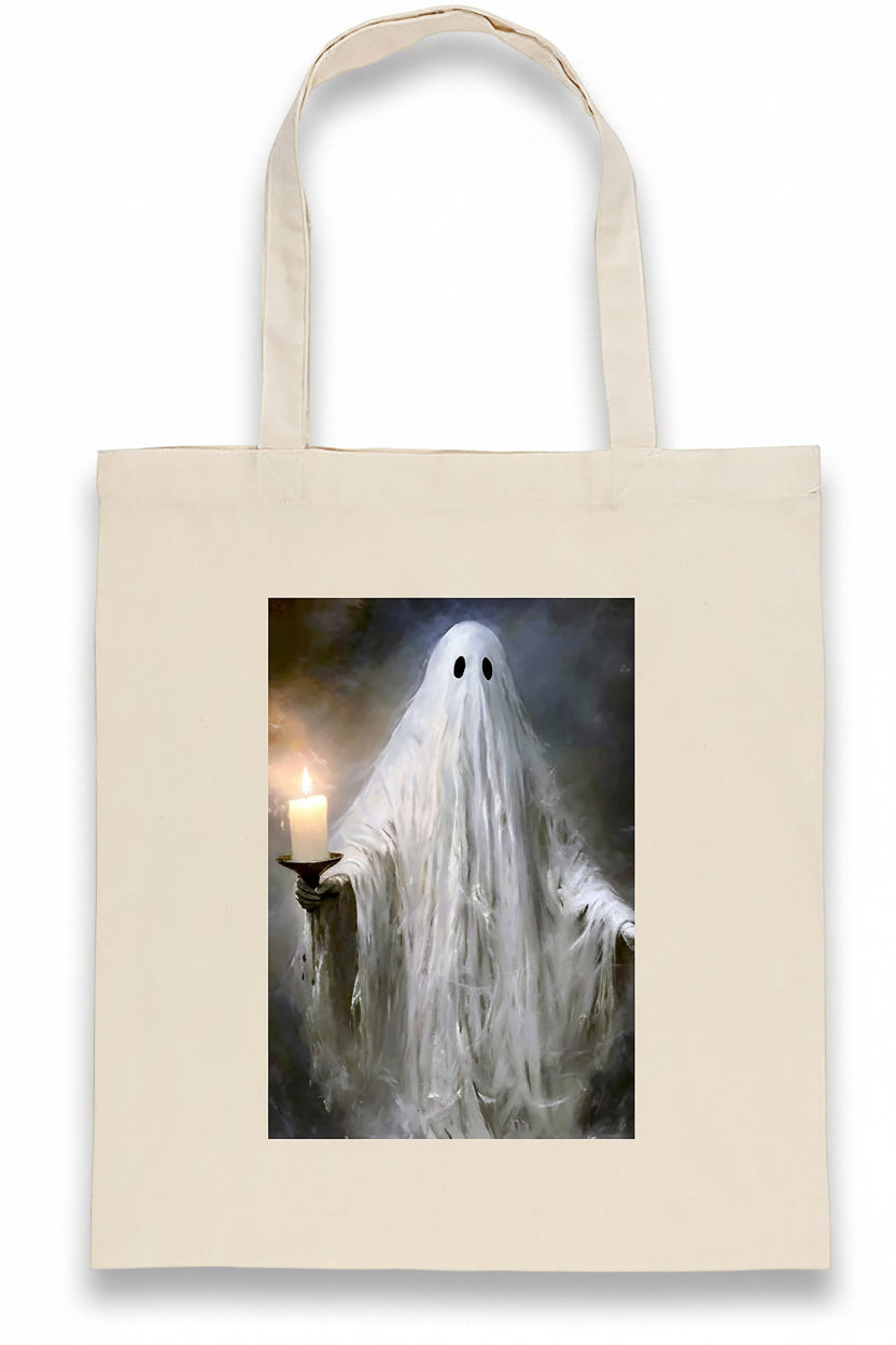 A cream-colored canvas tote bag featuring a printed graphic of a ghostly figure holding a lit candle, set against a plain white background.