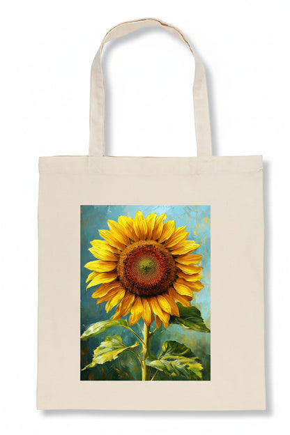 A natural canvas tote bag featuring a large, colorful printed painting of a sunflower on the front, set against a plain white background.