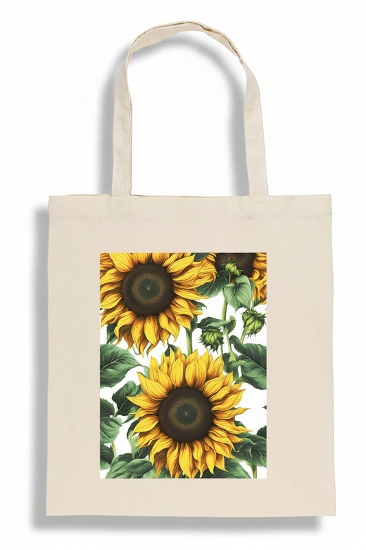 A natural canvas tote bag featuring a large rectangular print of two yellow sunflowers with green leaves on the front, set against a plain white background.