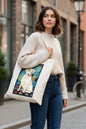 A cream-colored canvas tote bag featuring a graphic print of a yellow Labrador Retriever sitting on a dark background with colorful geometric shapes and autumn leaves. The text on the print reads 'STUDIO WORK FIRM GELBER LABRADOR'.