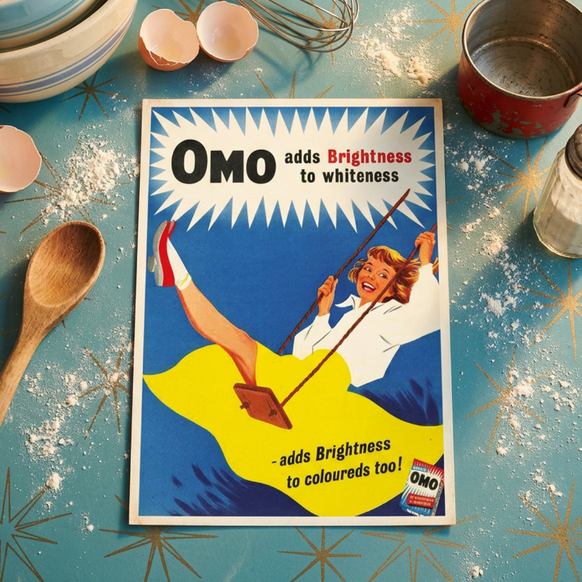 Vintage OMO advertising poster featuring a woman on a swing against a blue background, with large text reading 'OMO adds Brightness to whiteness' and 'adds Brightness to coloureds too!'.